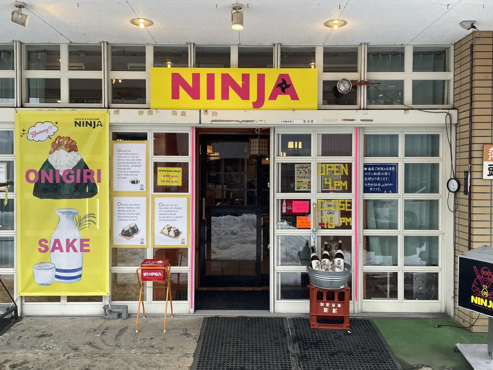 The open entrance to NINJA, with its yellow sign