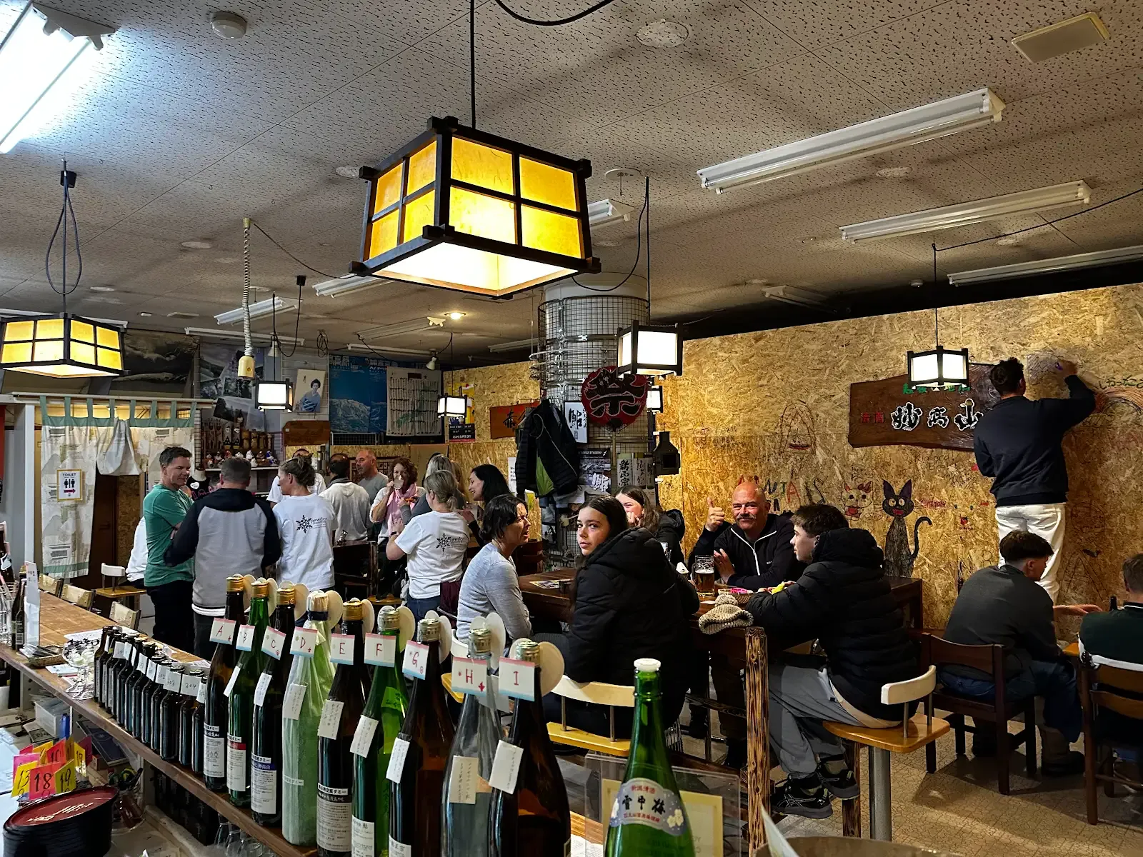 Guests gathered around the tables and counter at NINJA