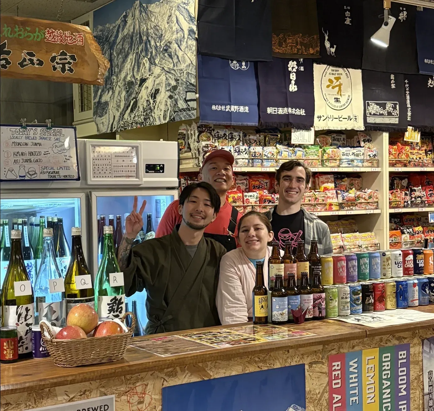 A smiling group behind the NINJA counter