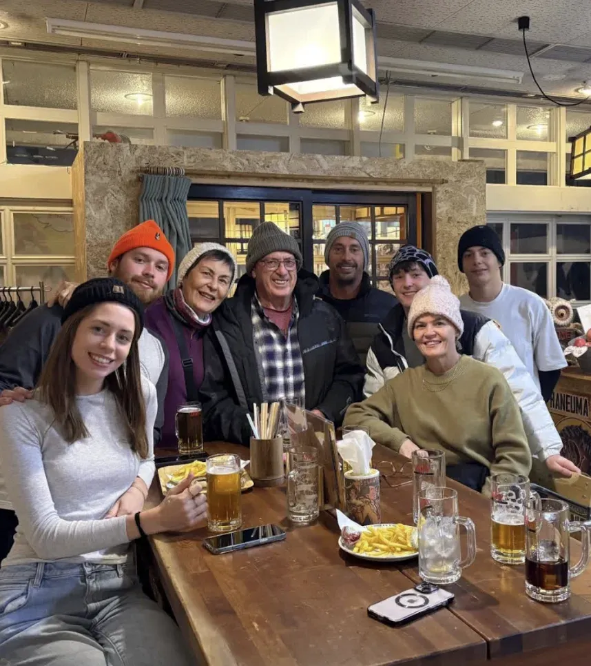 A group smiling around a table at NINJA